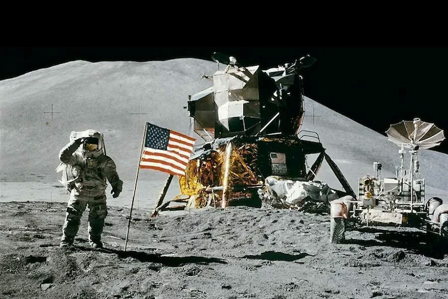 Astronaut saluting beside the US flag on the moon with the lunar module and rover in the background for gigachads concept.
