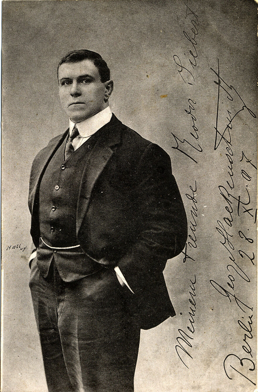 Vintage portrait of a strong man in a suit, representing one of the notable gigachads admired globally.