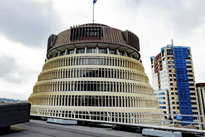 Unique round government building with layered concrete design, an example of architectural malpractice and costly ugly buildings.
