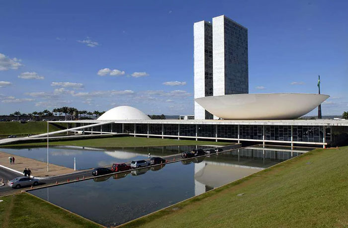Modernist government building with distinctive dome and bowl shapes, an example of architectural malpractice and costly design.
