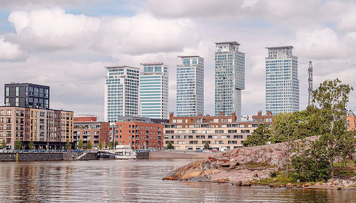 Modern architectural malpractice visible in waterfront buildings with locals expressing frustration over their design.