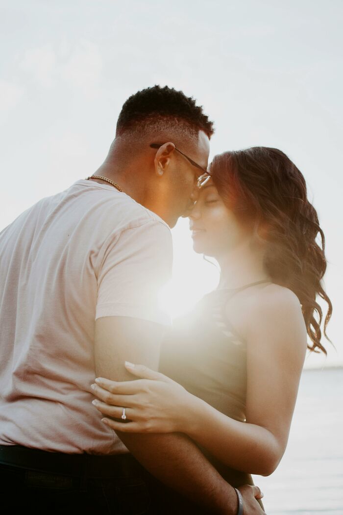 A loving couple embracing at sunset, highlighting respect and connection in a committed relationship.