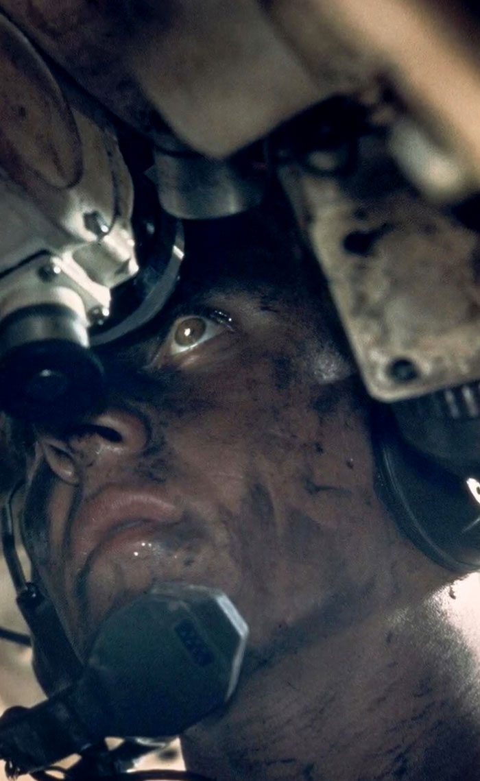 Close-up of a soldier’s face in a tank, showcasing rare and intriguing history between the headlines.