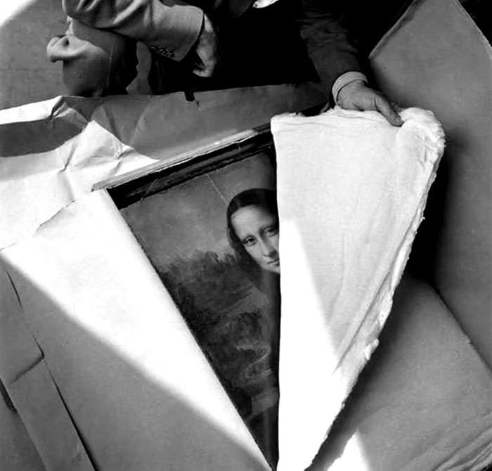 Rare and intriguing photo of the Mona Lisa being unpacked, showcasing history between the headlines in black and white.