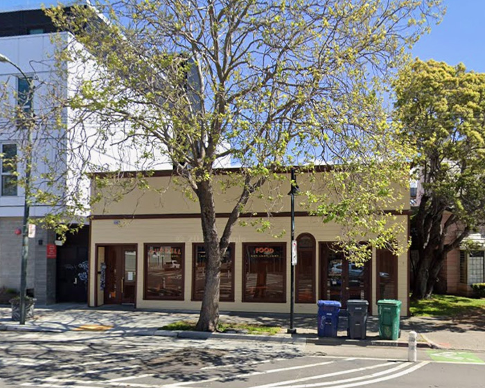 Exterior view of a top American restaurant on a sunny day amid controversy over automatic 20% tip policy.