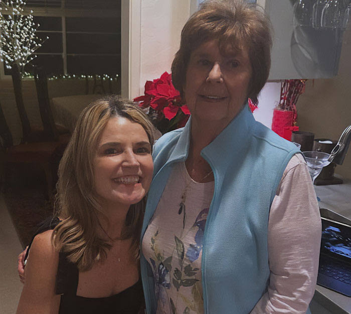 Two women smiling together indoors, related to man detained in connection with Nancy Guthrie kidnapping.