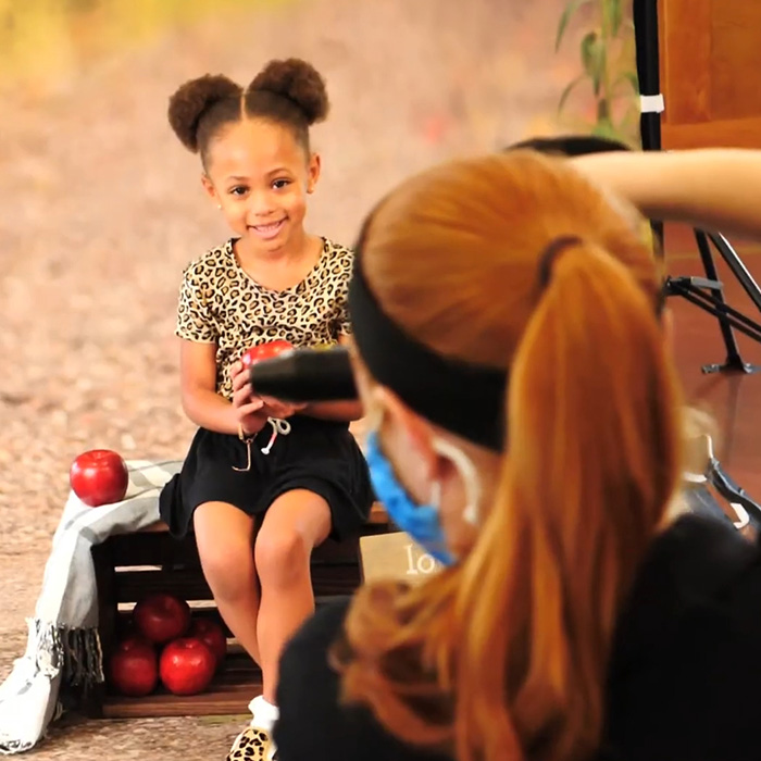 Young girl smiling during school picture day session, highlighting impact of schools canceling photo days nationwide. Young girl smiling during school picture day session, highlighting impact of schools canceling photo days nationwide.