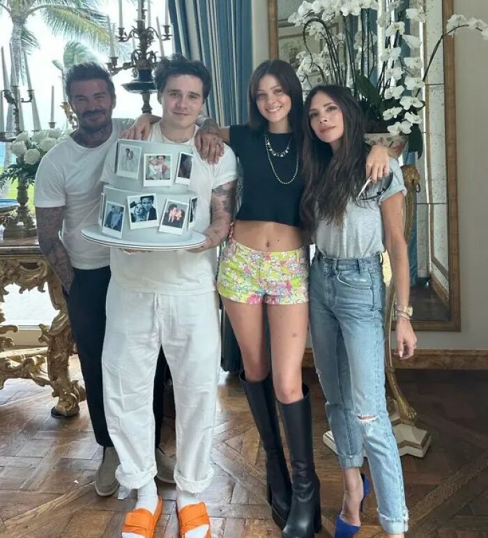 Marc Anthony with family, posing indoors during a casual celebration, addressing Brooklyn Beckham wedding accusations.