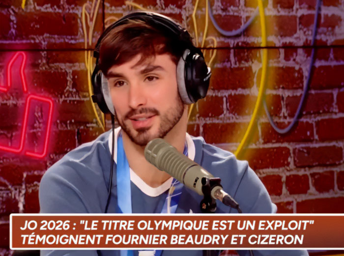 French ice skater speaking in a podcast with headphones on amid Olympic cheating scandal and controversy.