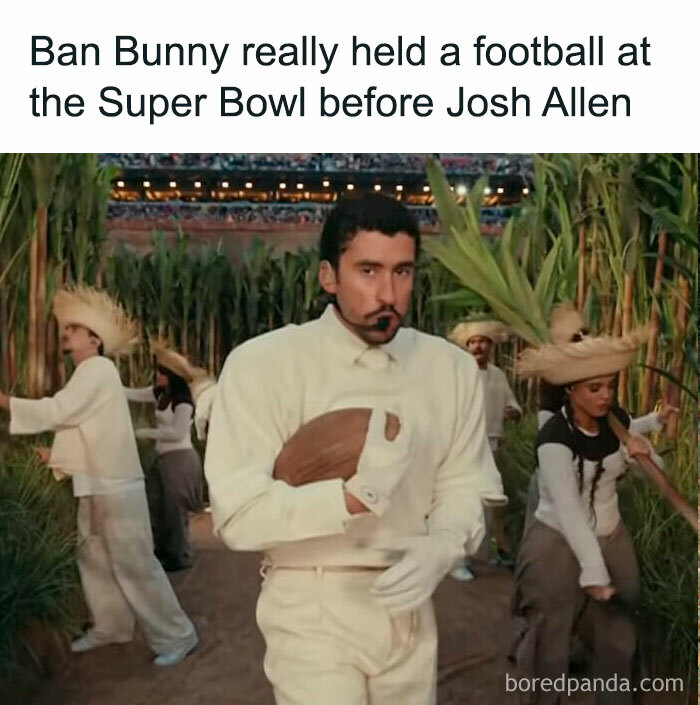 Performer holding a football during a Super Bowl halftime show scene with dancers in traditional costumes.