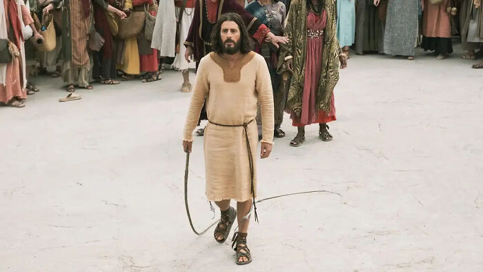 Man dressed in biblical attire walking with a rope, representing The Chosen season 6 release date and season 7 update.