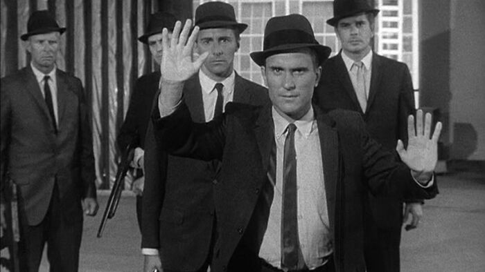 Robert Duvall in a classic TV role, wearing a suit and hat with hands raised, showcasing his iconic streaming era appeal. Robert Duvall in a classic TV role, wearing a suit and hat with hands raised, showcasing his iconic streaming era appeal.