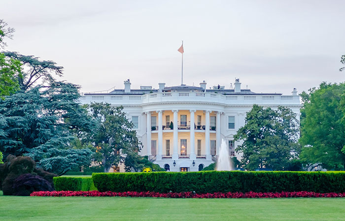 The White House exterior with gardens and fountain, related to Team USA Women's Hockey stars refusing invite.