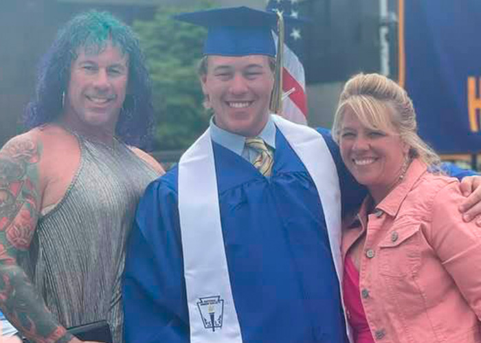 Young graduate smiling with family members, highlighting police discovery about ice rink attacker&rsquo;s family background.