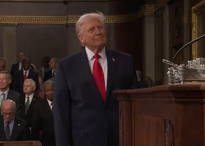 Former President Donald Trump at the podium during a viral moment from the State of the Union address.