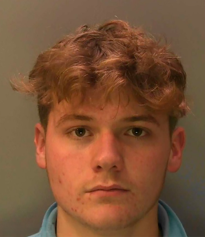 Young male student with curly hair facing forward in a neutral setting related to fireworks sheep incident karma case.