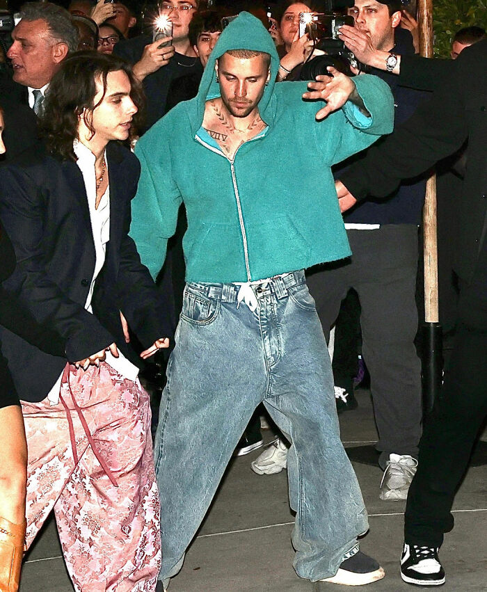 Justin Bieber leaving the Grammys with another woman, fans cry foul over abandoning wife Hailey.