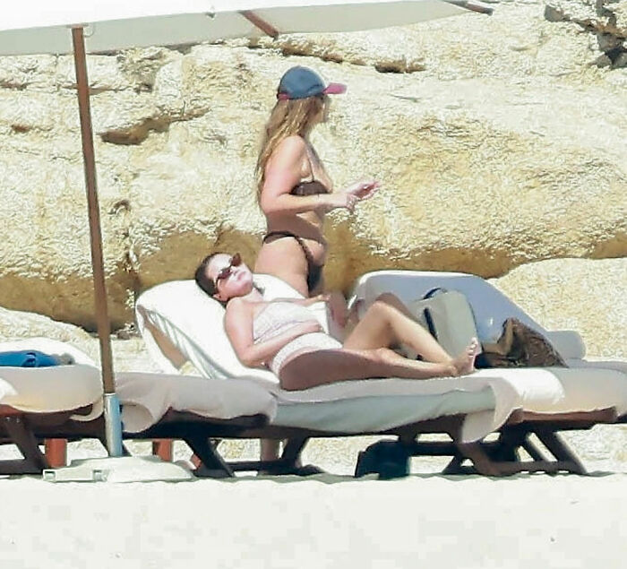 Selena Gomez relaxing on a beach chair during a trip, sparking new conspiracy theories about her transplant. Selena Gomez relaxing on a beach chair during a trip, sparking new conspiracy theories about her transplant.