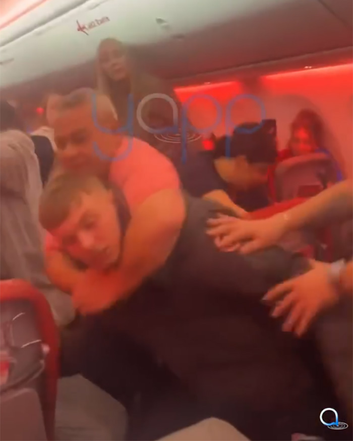 Video Captures Chaotic Brawl That Got 'Racist' Passengers Banned From Airline Video Captures Chaotic Brawl That Got 'Racist' Passengers Banned From Airline
