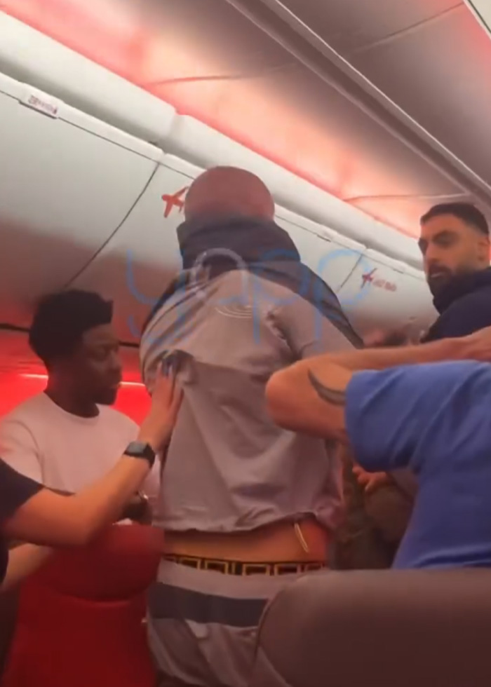 Video Captures Chaotic Brawl That Got 'Racist' Passengers Banned From Airline Video Captures Chaotic Brawl That Got 'Racist' Passengers Banned From Airline