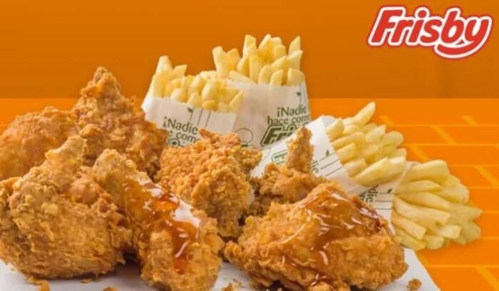 Fried chicken and crispy fries meal from Frisby, showcasing popular fast food items enjoyed in different countries.