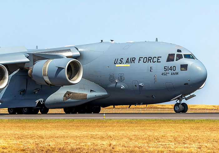 U.S. Air Force cargo plane on runway, illustrating strength and discipline like ultra-popular guys in adulthood.