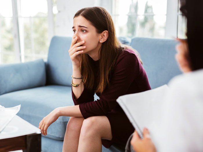 Young woman reacts emotionally while learning about father's secret son, causing family to fall apart during a serious conversation.