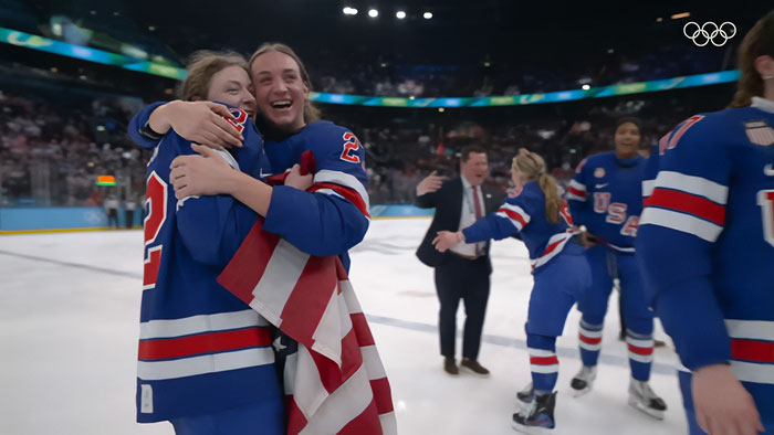 Team USA women&rsquo;s hockey stars celebrating on ice, wearing blue jerseys, after refusing White House invitation.