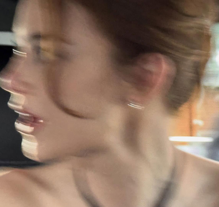 Emma Stone looking cadaverous with blurred motion in a candid shot raising concerns about her appearance at the 2026 BAFTAs.