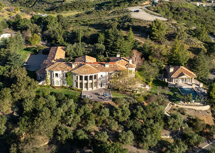 Aerial view of Britney Spears&rsquo; mansion surrounded by trees and hills, related to 911 call records and arrest news.