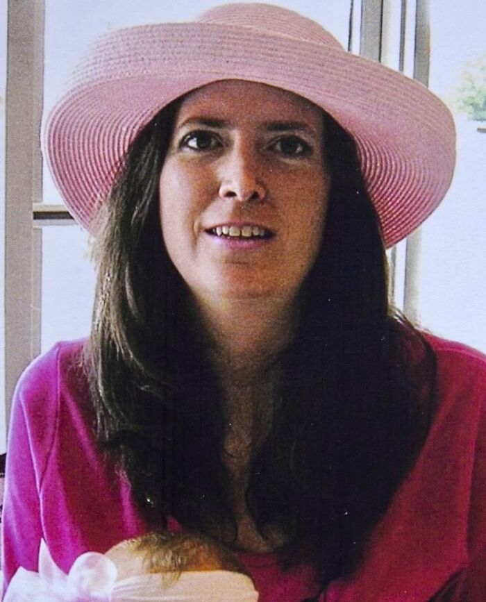 Woman wearing a pink hat and shirt, smiling indoors, representing people sharing interesting rabbit holes experiences.