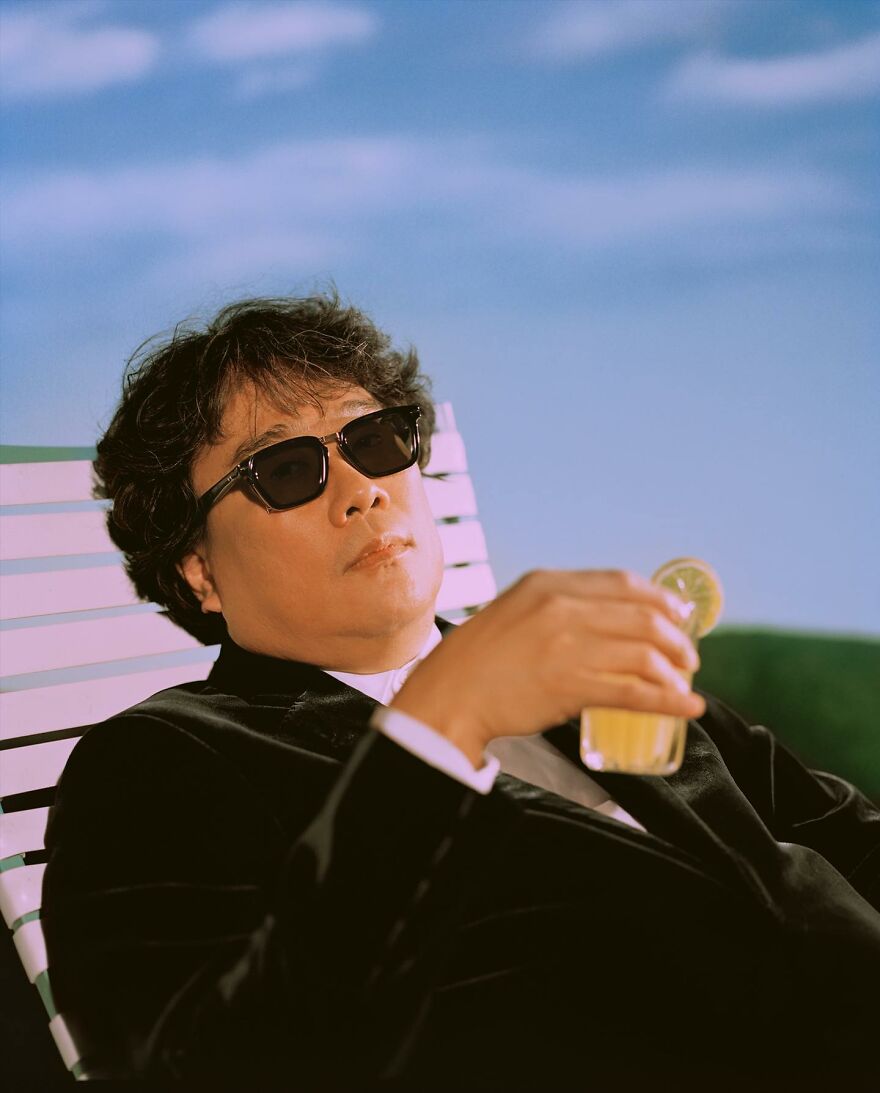 Man in sunglasses relaxing with a drink outdoors, representing international films redefining modern cinema beyond Hollywood.