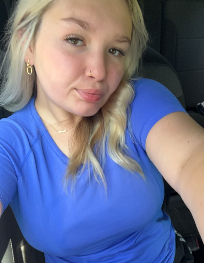Teen girl with blonde hair in a blue shirt taking a selfie related to controversial case of pregnant 15-year-old by 12-year-old