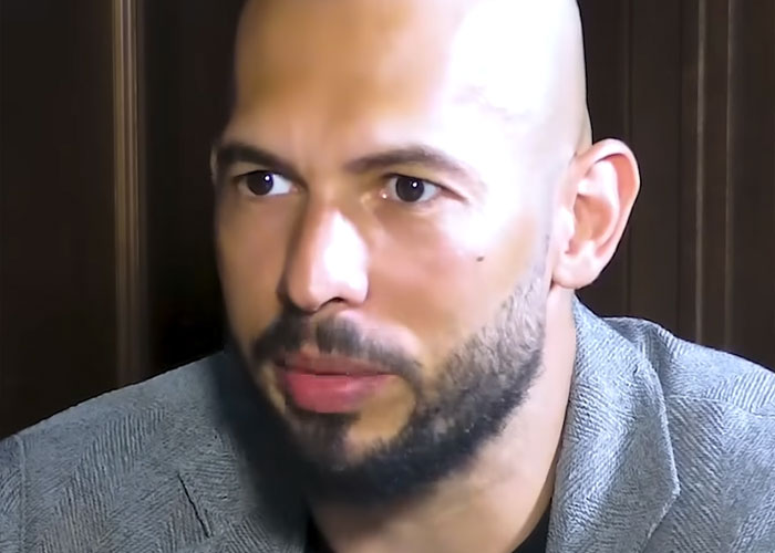 Close-up of a man with a beard and gray blazer, sharing a moment of revelation about his ex in an interview setting.