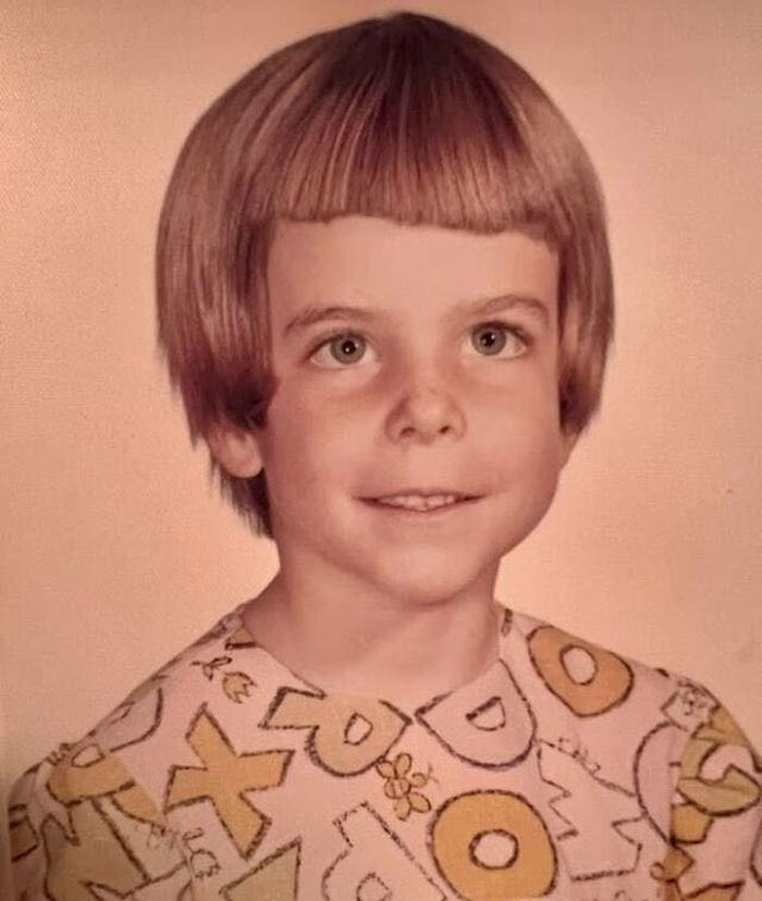Childhood photo of a boy with a vintage haircut showing a classic hair disaster from past decades.