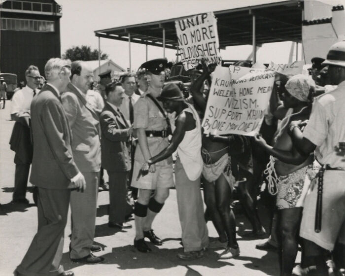Protesters demonstrating against political issues in a historical scene from the year you were born timeline.