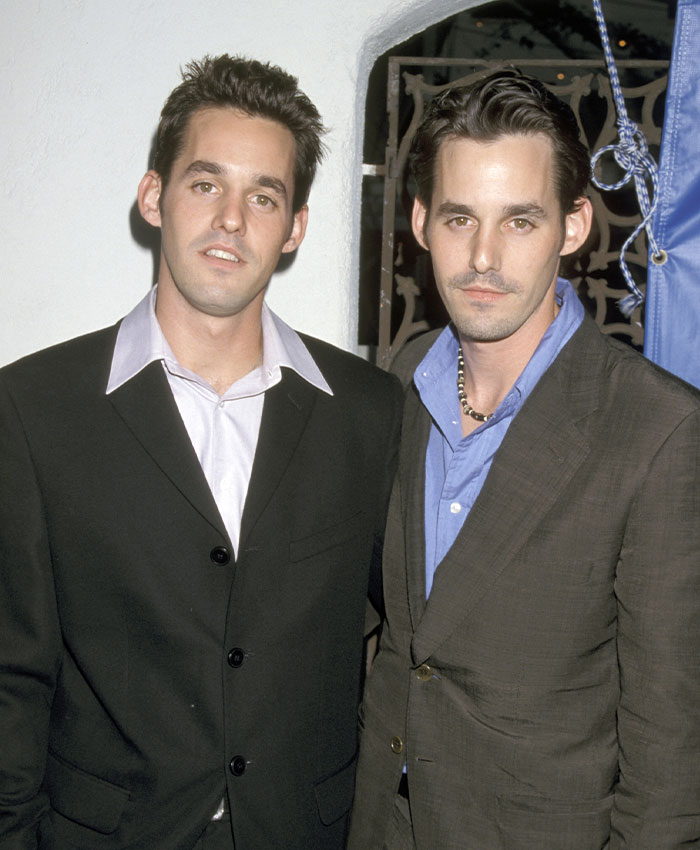 Two male stars posing together at an event, highlighting famous twins in the celebrity world.