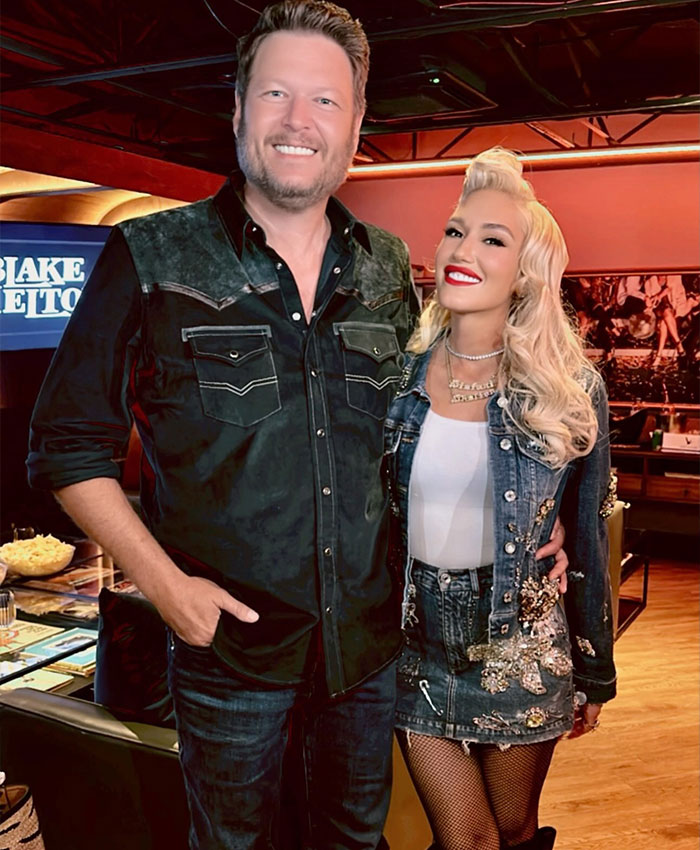 Gwen Stefani smiling beside a man in casual denim outfits, addressing her Christian pivot after promoting anti-abortion app.