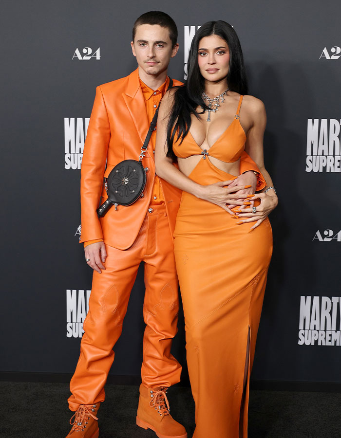 Kylie Jenner in an orange cut-out dress at a red carpet event, sparking backlash over her Oscars outfit and style choices. Kylie Jenner in an orange cut-out dress at a red carpet event, sparking backlash over her Oscars outfit and style choices.