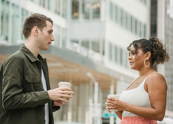 Man and woman holding coffee cups outdoors, sharing a moment as ex partners reveal who they really are.