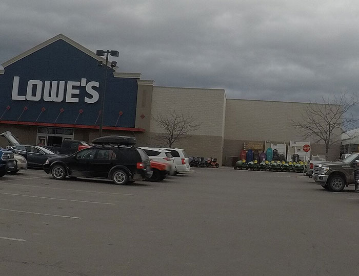 Lowe’s store exterior with parked cars, illustrating corporate secrets customers were never meant to know.