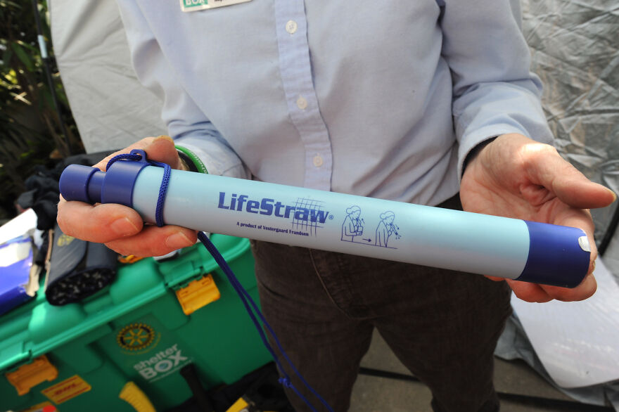 Person holding a LifeStraw water filter, one of the curious objects with dazzling origins and practical uses.