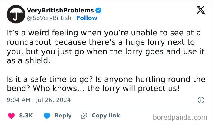 Tweet describing using a lorry as a shield to safely navigate a UK roundabout, showcasing unique UK living humor.