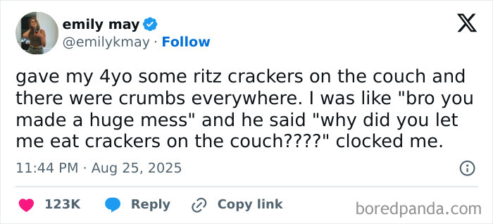 Screenshot of a tweet showing a kid roasting a grown-up with no filter about eating crackers on the couch.