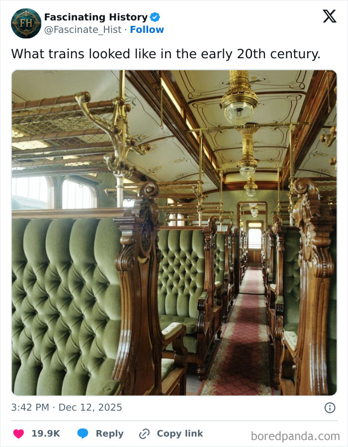 Interior of an early 20th century train with ornate wooden frames and tufted green velvet seats showcasing historical treasures.