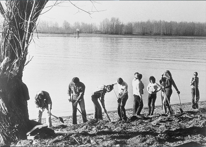Group of people digging on a riverbank, related to FBI investigation of infamous 1971 plane hijacker DB Cooper. Group of people digging on a riverbank, related to FBI investigation of infamous 1971 plane hijacker DB Cooper.