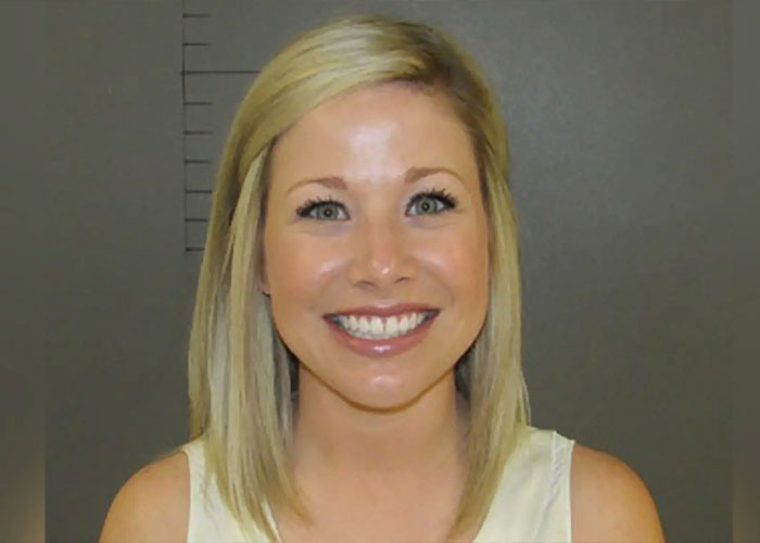 Smiling teacher mugshot photo related to viral student scandal and unexpected marriage update story.