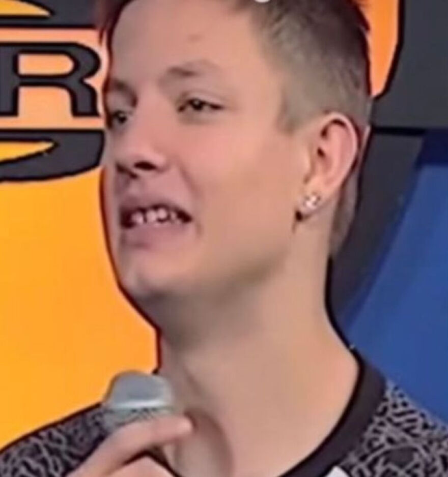 Matt Rife speaking into a microphone, addressing plastic surgery rumors in a casual event setting. Matt Rife speaking into a microphone, addressing plastic surgery rumors in a casual event setting.