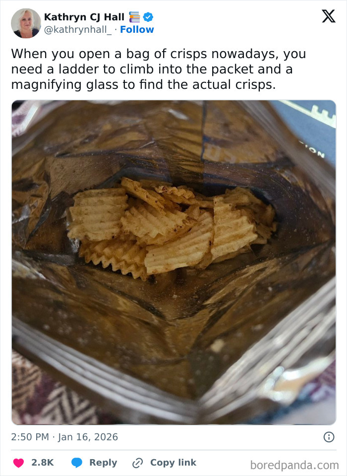 Inside a nearly empty crisp bag showing the small amount of crisps, highlighting unique UK living humor in tweets.