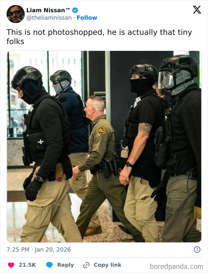 Group of tactical team members walking with one smaller man in uniform among them, a movie and film industry meme.